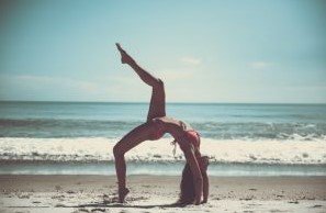 girl exercise on beach